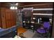 Spacious bedroom with wood paneled walls and a ceiling fan at 6503 Old Macon Hwy, Rex, GA 30273