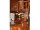 Open dining room featuring hardwood floors and an open kitchen with black appliances at 6503 Old Macon Hwy, Rex, GA 30273