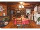 Open dining room features hardwood floors and an open view of the fireplace in the living room at 6503 Old Macon Hwy, Rex, GA 30273