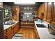 Charming kitchen with wood cabinets, white countertops, and rustic decor at 6503 Old Macon Hwy, Rex, GA 30273