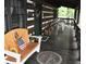 Covered porch with outdoor furniture and fire pit at 6503 Old Macon Hwy, Rex, GA 30273
