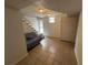 Finished basement area with tiled floors and a stairway leading to the upper level, great for storage at 1379 Pair Sw Rd, Marietta, GA 30008