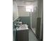 Vintage bathroom features a classic blue tile design with a sink, toilet, and shower at 1379 Pair Sw Rd, Marietta, GA 30008