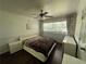 Cozy bedroom with hardwood floors, a ceiling fan, and neutral decor, offering a serene retreat at 1379 Pair Sw Rd, Marietta, GA 30008