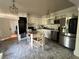 Bright kitchen featuring modern appliances, light cabinets, and a cozy breakfast nook for casual dining at 1379 Pair Sw Rd, Marietta, GA 30008