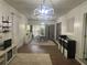 Stylish living room featuring tile floors, modern lighting, and neutral decor offering a welcoming ambiance at 1379 Pair Sw Rd, Marietta, GA 30008