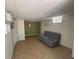 Relaxing living room with neutral flooring, soft green accent wall, and a modern sofa at 1379 Pair Sw Rd, Marietta, GA 30008