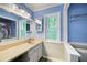 A bathroom with a window over the counter that brings natural lighting into the space at 2317 Danielle Ct, Marietta, GA 30062