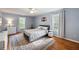 Tranquil bedroom with hardwood floors, area rug, neutral walls, and windows for natural light at 2317 Danielle Ct, Marietta, GA 30062