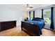 Bedroom with hardwood floors, ceiling fan, and lots of natural light at 2317 Danielle Ct, Marietta, GA 30062