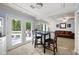 Bright breakfast nook with French doors to the deck, a table set for two, and access to living area at 2317 Danielle Ct, Marietta, GA 30062