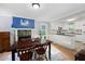Cozy dining room adjacent to an open kitchen, featuring a fireplace, hardwood floors and natural light at 2317 Danielle Ct, Marietta, GA 30062