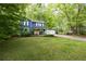 Charming two-story home with a blue exterior, yellow door and manicured front lawn at 2317 Danielle Ct, Marietta, GA 30062