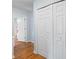 Hallway featuring hardwood floors and white closet doors at 2317 Danielle Ct, Marietta, GA 30062