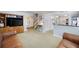 Spacious living room with a large TV, wooden cabinets, and an open layout at 2317 Danielle Ct, Marietta, GA 30062