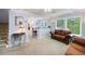 Open-concept living area with a comfortable sofa, bar seating, and natural light at 2317 Danielle Ct, Marietta, GA 30062