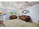 Cozy living room with comfortable leather sofas, neutral carpet, and natural lighting at 2317 Danielle Ct, Marietta, GA 30062