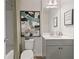 Modern bathroom with a gray vanity, white countertop, and framed abstract art at 400 Brooch Way, Stockbridge, GA 30281