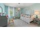 Bright bedroom with a unique light fixture, patterned pillows, and a canopy daybed at 400 Brooch Way, Stockbridge, GA 30281