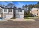 View of new construction townhomes, showcasing the community and available parking at 400 Brooch Way, Stockbridge, GA 30281