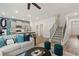 Open layout featuring living, kitchen, and stairwell areas at 400 Brooch Way, Stockbridge, GA 30281