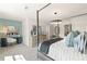 Open bedroom with a decorative desk, dresser, and comfortable seating at 400 Brooch Way, Stockbridge, GA 30281