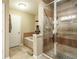 Elegant bathroom featuring a glass-enclosed shower and a luxurious soaking tub at 220 Pitts Chapel Rd, Newborn, GA 30056