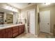 Well-lit bathroom featuring double vanity sinks, large mirror, and separate toilet and shower area at 220 Pitts Chapel Rd, Newborn, GA 30056