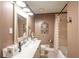 Stylish bathroom with a spacious vanity and combined tub and shower at 220 Pitts Chapel Rd, Newborn, GA 30056