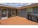 Outdoor deck area with screened porch access and outdoor grill for entertainment at 220 Pitts Chapel Rd, Newborn, GA 30056