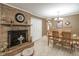 Inviting dining room with a stone fireplace and open floor plan at 220 Pitts Chapel Rd, Newborn, GA 30056