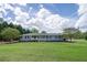 Charming single-story home with a well-maintained lawn, classic shutters, and mature landscaping at 220 Pitts Chapel Rd, Newborn, GA 30056