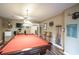 Large game room with pool table, TV, and accessories, ideal for entertaining and recreation at 220 Pitts Chapel Rd, Newborn, GA 30056