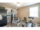 Home gym with window, ceiling fan, and exercise equipment, perfect for workouts at 220 Pitts Chapel Rd, Newborn, GA 30056