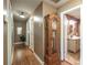 Inviting hallway with classic wood floors and views into the bathroom and other rooms at 220 Pitts Chapel Rd, Newborn, GA 30056