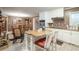 Kitchen view showcases a breakfast bar, seamlessly connecting to the dining area at 220 Pitts Chapel Rd, Newborn, GA 30056