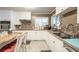 Kitchen with white cabinets, breakfast bar, and tile flooring, offering modern functionality at 220 Pitts Chapel Rd, Newborn, GA 30056