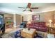 Inviting living room with hardwood floors, classic decor, and plenty of natural light at 220 Pitts Chapel Rd, Newborn, GA 30056