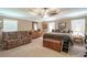 Expansive main bedroom with tray ceiling, plush seating, and generous closet space at 220 Pitts Chapel Rd, Newborn, GA 30056