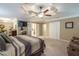 Comfortable main bedroom with carpet, tray ceiling, and neutral paint, creating a relaxing atmosphere at 220 Pitts Chapel Rd, Newborn, GA 30056