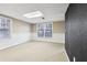 Basement featuring wainscotting, carpet flooring, and large windows at 2667 Fieldstone Se Dr, Conyers, GA 30013