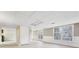 Bright finished basement with white walls, light carpet, large windows, and double doors at 2667 Fieldstone Se Dr, Conyers, GA 30013
