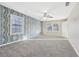 Spacious bedroom with carpet, decorative wallpaper and a window at 2667 Fieldstone Se Dr, Conyers, GA 30013