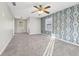 Bedroom with unique wallpaper, carpet flooring, and a ceiling fan at 2667 Fieldstone Se Dr, Conyers, GA 30013