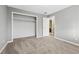 Comfortable bedroom with carpet, closet, and white door leading to the ensuite bathroom at 2667 Fieldstone Se Dr, Conyers, GA 30013