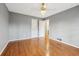 Neutral bedroom featuring wood floors and open closet at 2667 Fieldstone Se Dr, Conyers, GA 30013