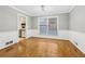 Open dining room with wooden floors, neutral paint, and large window perfect for Gathering dinners at 2667 Fieldstone Se Dr, Conyers, GA 30013