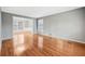 Inviting living room with gleaming hardwood floors, neutral paint, and bright natural light at 2667 Fieldstone Se Dr, Conyers, GA 30013
