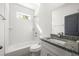 Bathroom featuring a shower and bathtub, toilet, and sink with a granite countertop at 281 Griffin Nw St, Atlanta, GA 30314
