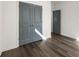 Bright bedroom featuring hardwood floors, grey walls, and closet area at 281 Griffin Nw St, Atlanta, GA 30314